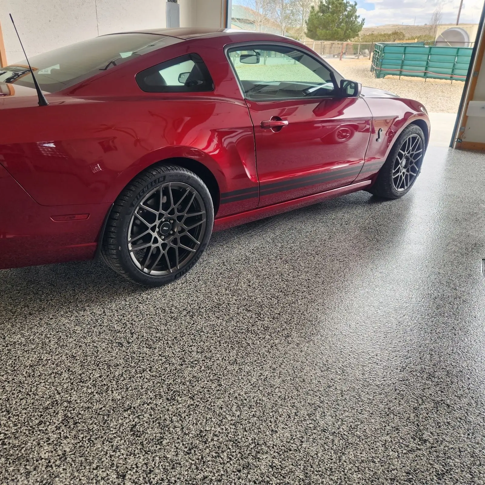 Red Car in garage with an epoxy floor